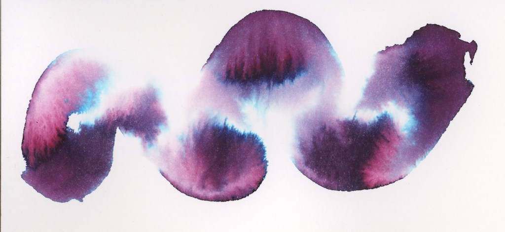 A detail chromatography swatch of Robert Oster Australian Opal Mauve on Strathmore watercolor paper, shown as a wide horizontal swoosh. The ink separates into rich pink, violet, and electric blue tones, with soft white blooming through the center. The smooth paper surface allows the colors to flow and blend freely.
