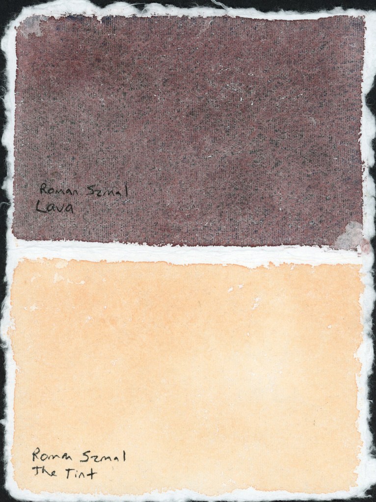 Two rectangular ink washes on handmade paper with deckled edges, photographed against a black background. The upper swatch shows Roman Szmal Lava, a deep muted purple-brown with visible granulation texture across the surface. The lower swatch shows Roman Szmal The Tint, a soft warm peachy cream, smooth and even. Both ink names handwritten below their respective swatches.