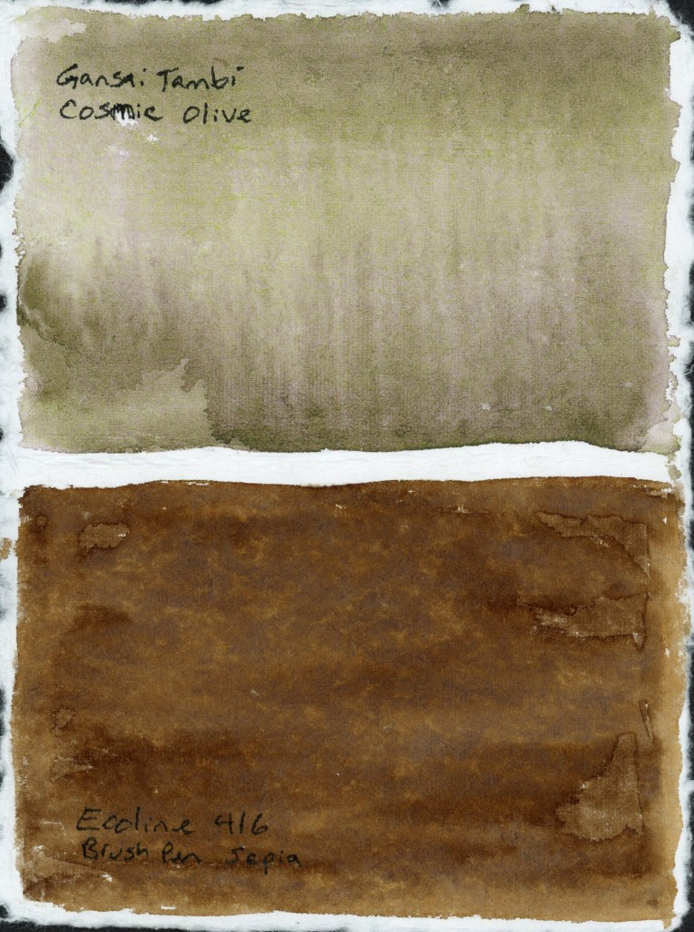 Two rectangular paint swatches on handmade paper with deckled edges. The upper swatch shows Gansai Tambi Cosmic Olive, a soft muted yellow-green with subtle granulation and gentle vertical streaking as the wash dried. The lower swatch shows Ecoline 416 Brush Pen Sepia, a rich warm brown with visible texture and slight mottling across the surface. Both names handwritten below their respective swatches.