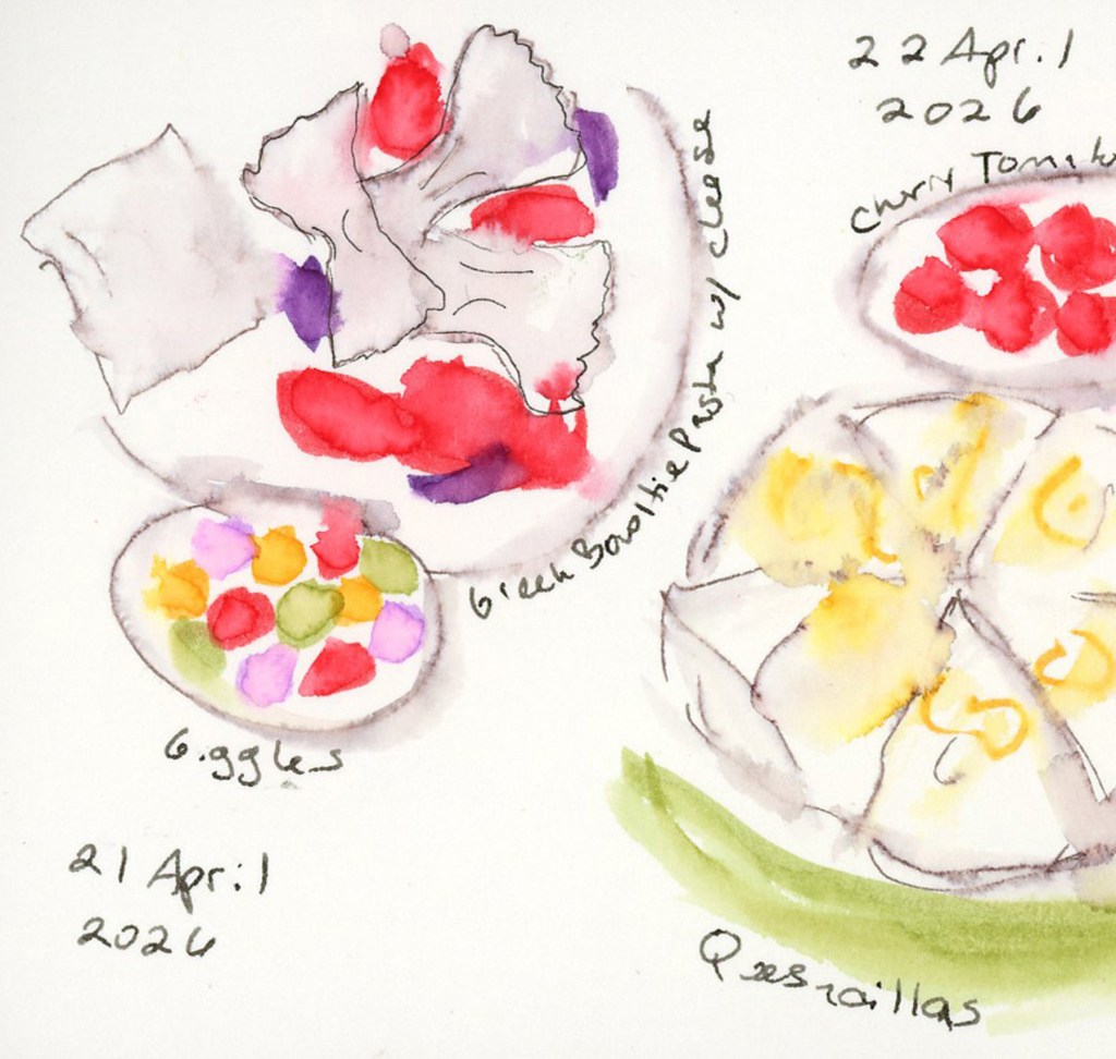 Close-up detail from the April 21–22, 2026 food diary spread. A bowl of Greek bowtie pasta with cheese sits beside a small round bowl of Giggles candy in cheerful confetti colors — red, orange, yellow, purple, and green — in a Stillman & Birn Delta sketchbook.