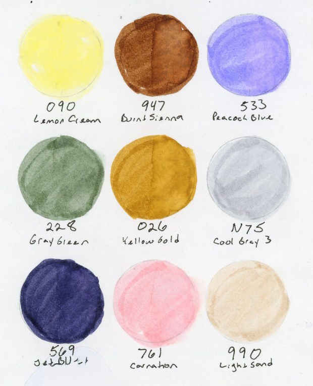 Circles of Tombow Dual Brush Markers swatching colors 090 Lemon Cream, 947 Burnt sienna, 533 Peacock Blue, 228 Gray Green, 026 Yellow Gold, N75 Cool Gray 3, 569 Jet Blue, 761 Carnation, 990 Light Sand.